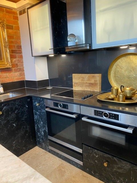 Double ovens and induction hob set in black marble