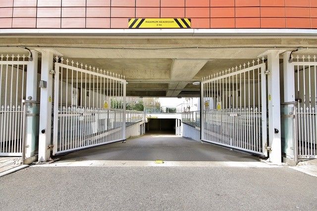Gated ramp down to secure underground parking